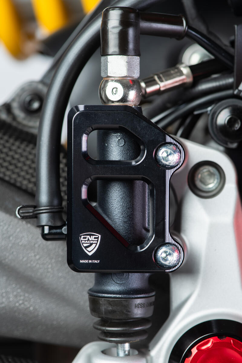 Rear brake master cylinder protector for factory rearsets